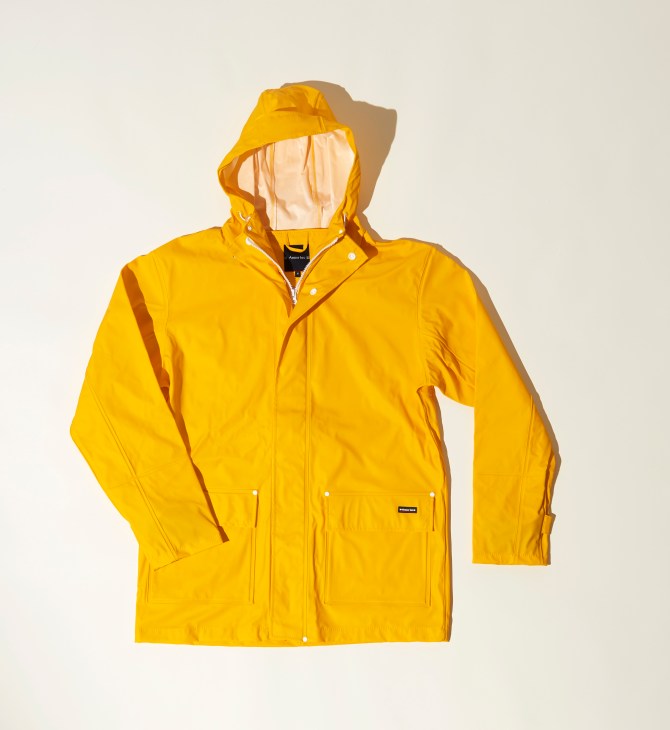 A bright yellow hooded raincoat with zipper closure and front pockets displayed against a neutral background