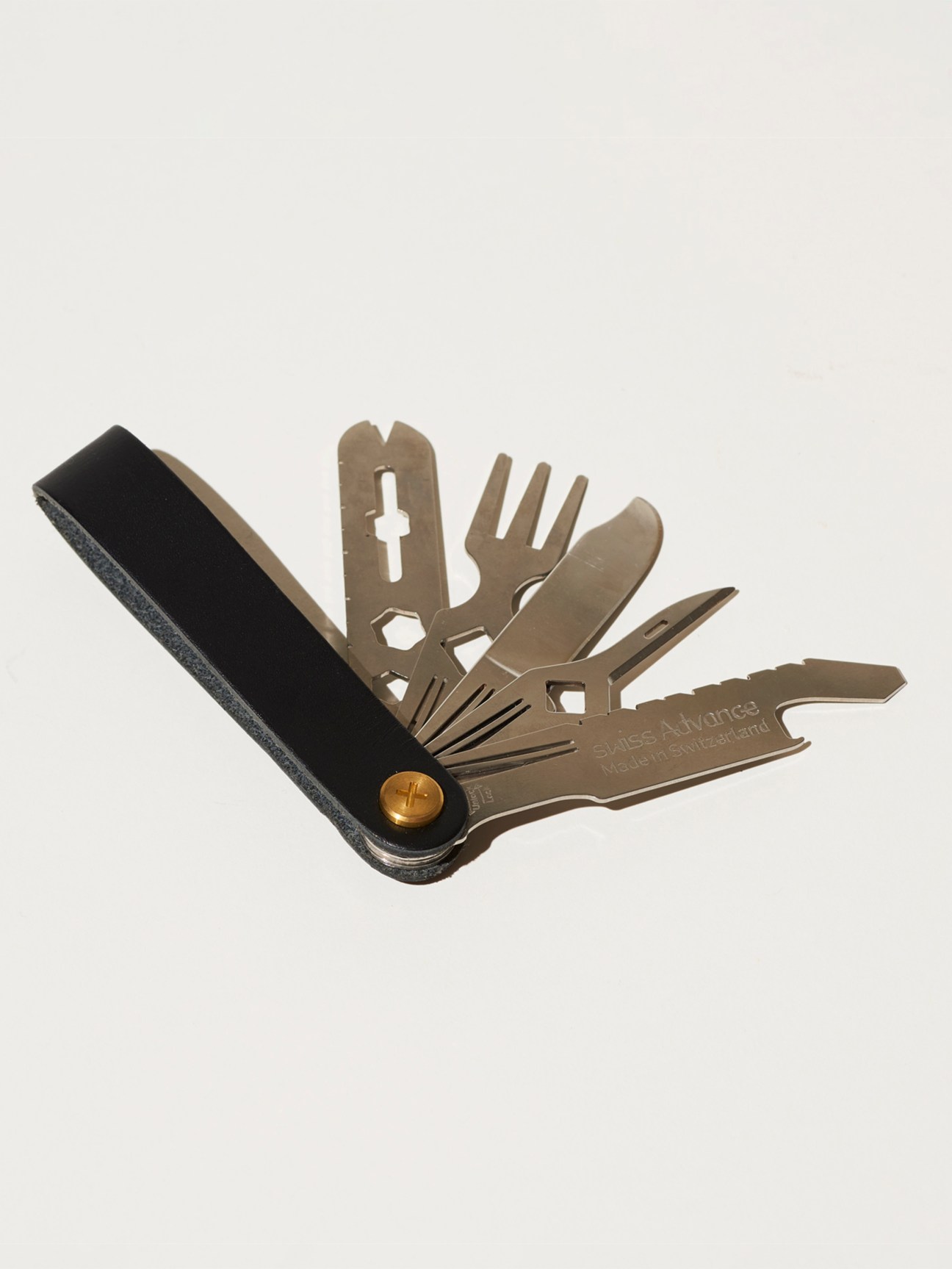Swiss Advance Crono N5 multi-tool knife with black handle and bronze-colored tools fanned out
