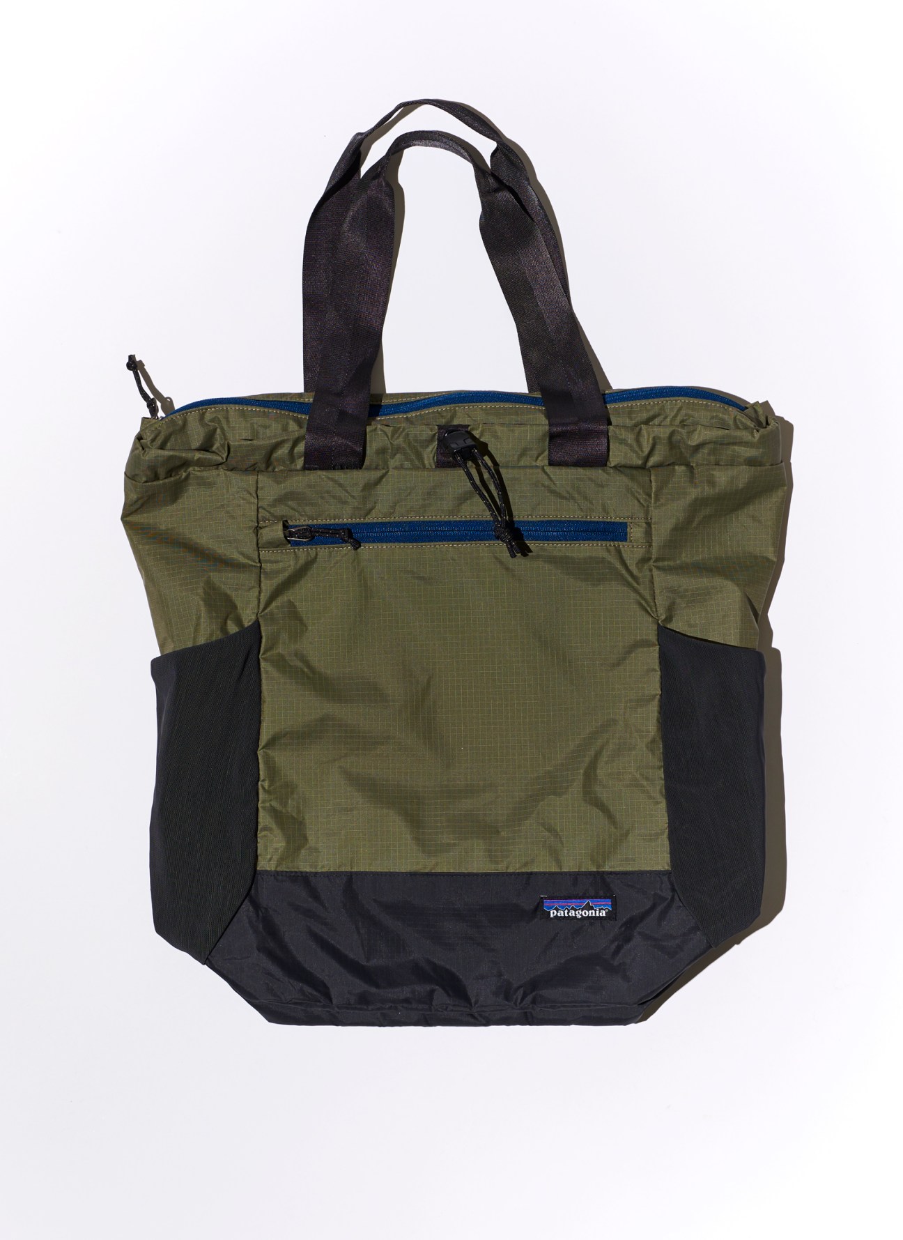 Patagonia Black Hole tote pack in olive green and black with blue zipper details and carrying handles