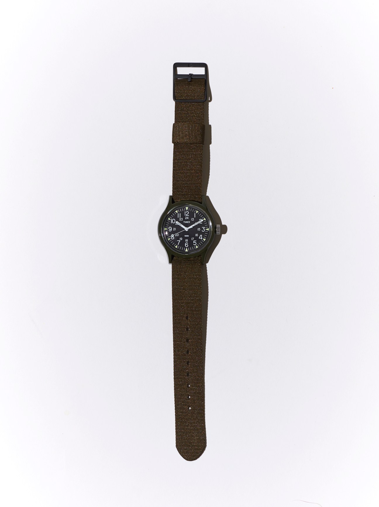 Timex Camper MK1 watch with olive green nylon strap and black case on white background