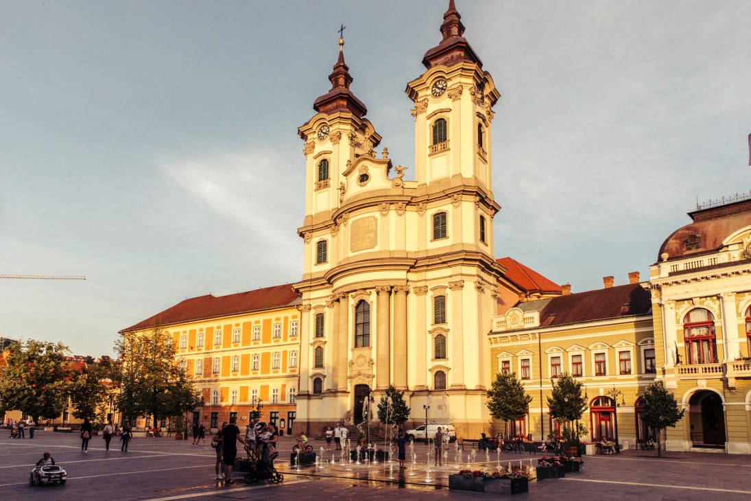 Eger town square with baroque Minorite Church and colorful historic buildings