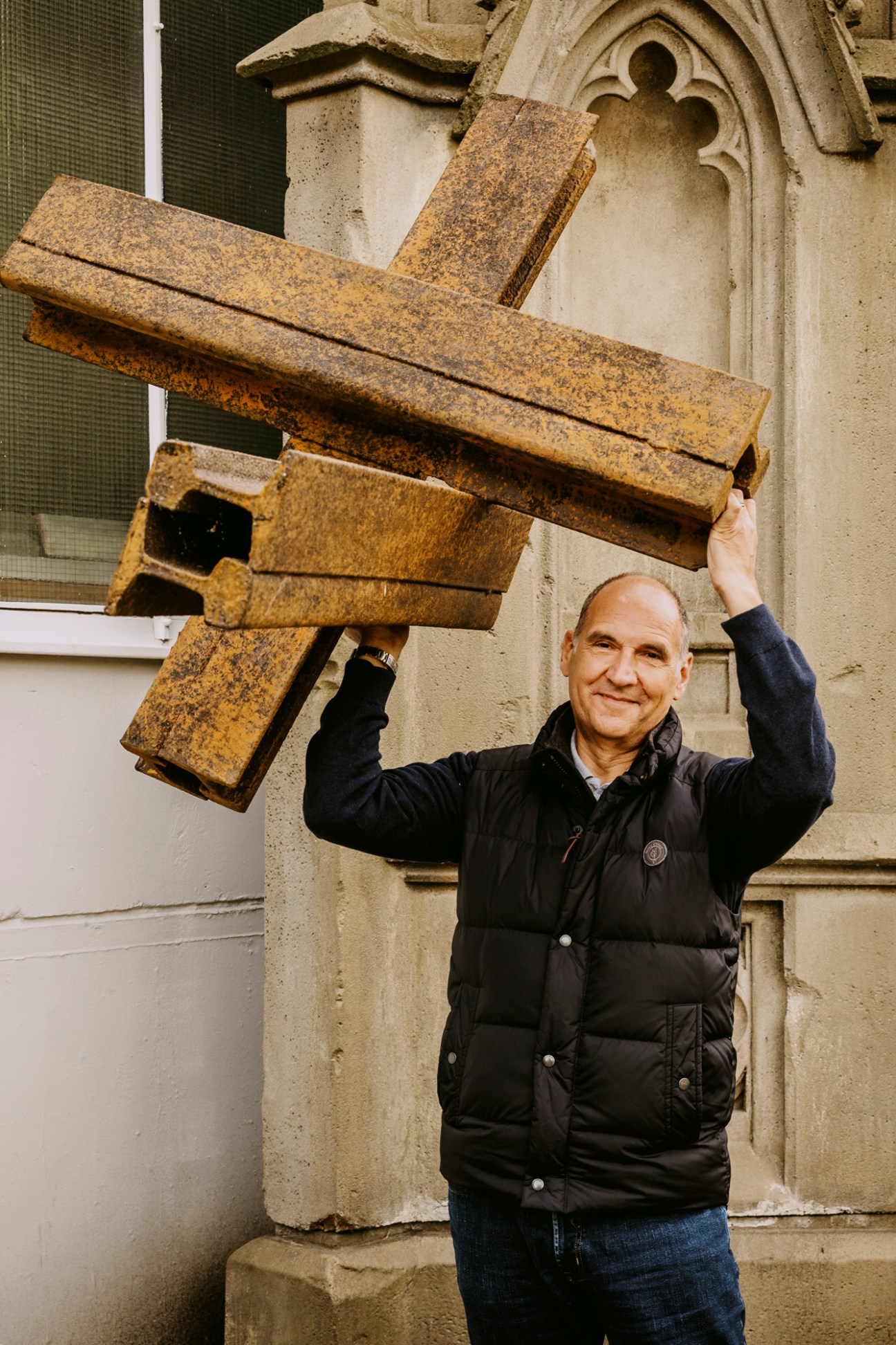 Managing director Michael Düwel holds up a mock anti-tank obstacle