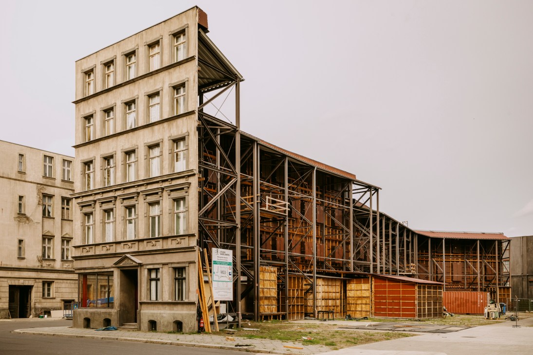 Historic building facades with metal scaffolding and construction work in Studio Babelsberg backlot
