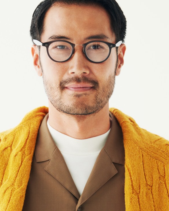Man wearing Brooksfield jumper, District United Arrows shirt, Urban Research t-shirt, and Eyevan glasses.