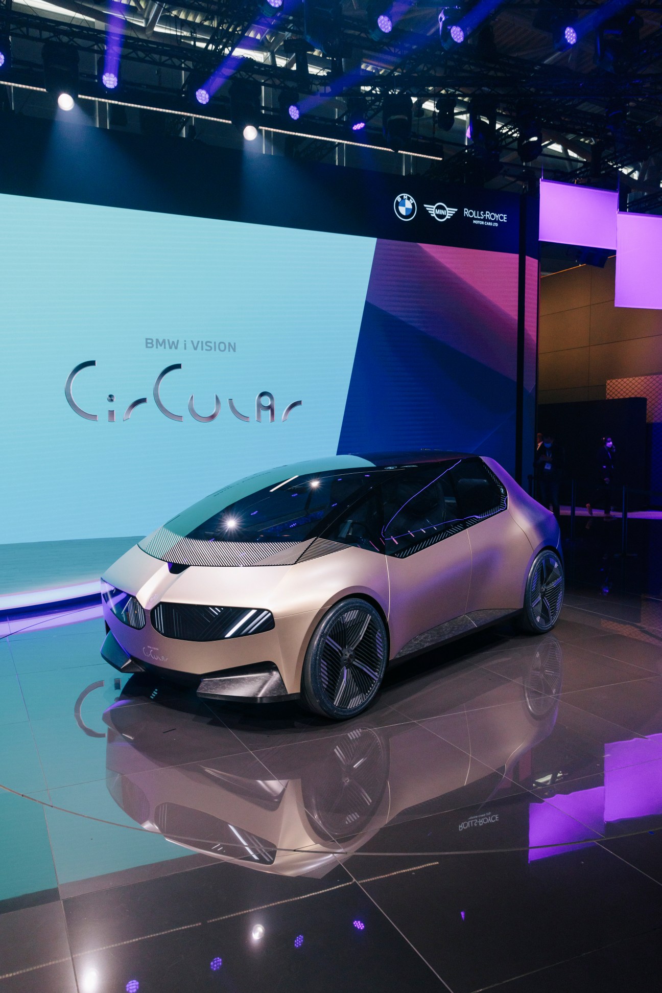 BMW i Vision Circular concept car displayed on illuminated stage at motor show