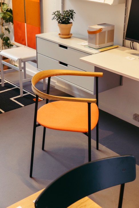 Modern flat-packed chair design displayed in minimalist interior setting.