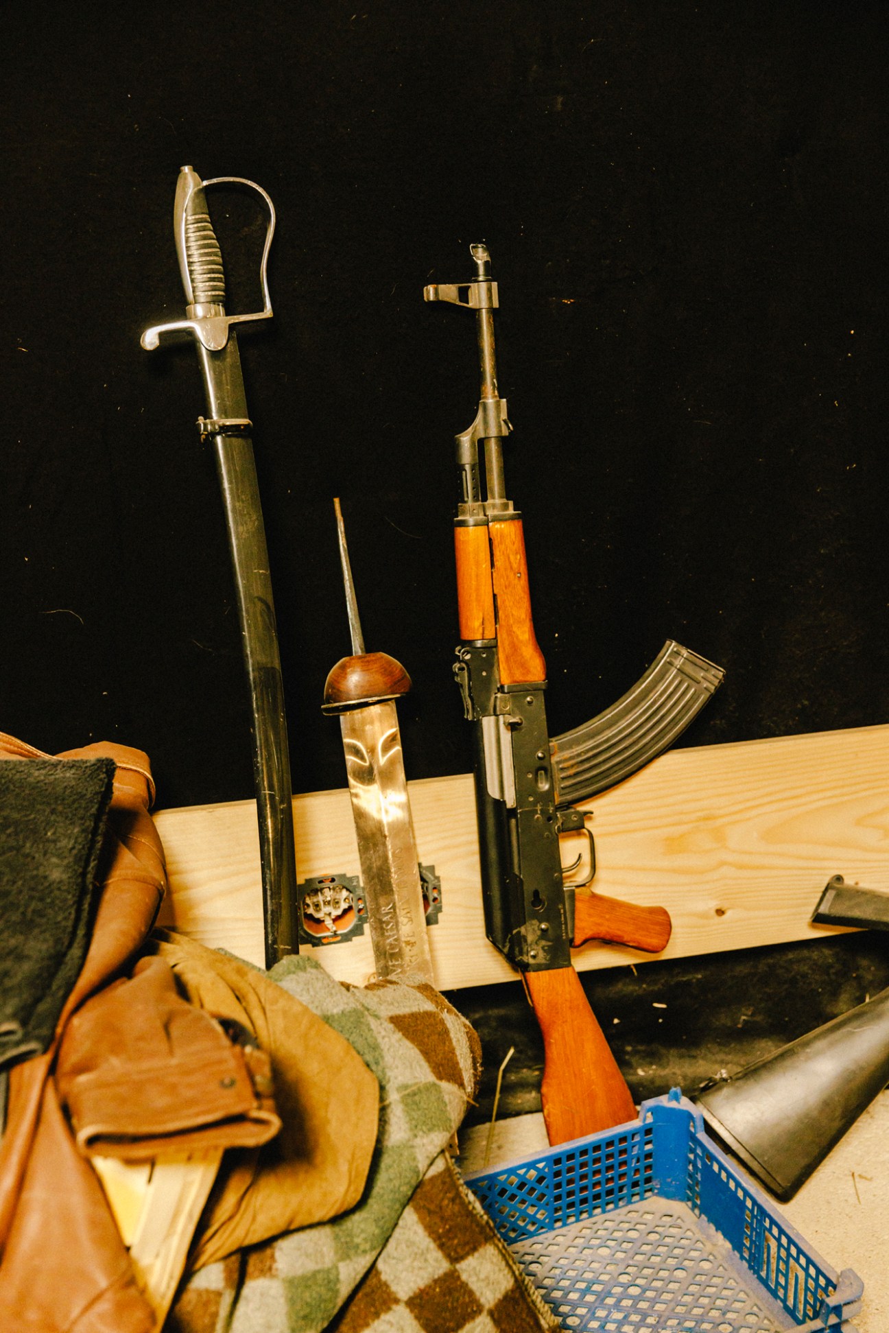 Collection of weapons and prop firearms displayed in storage at Foley Farmers studio