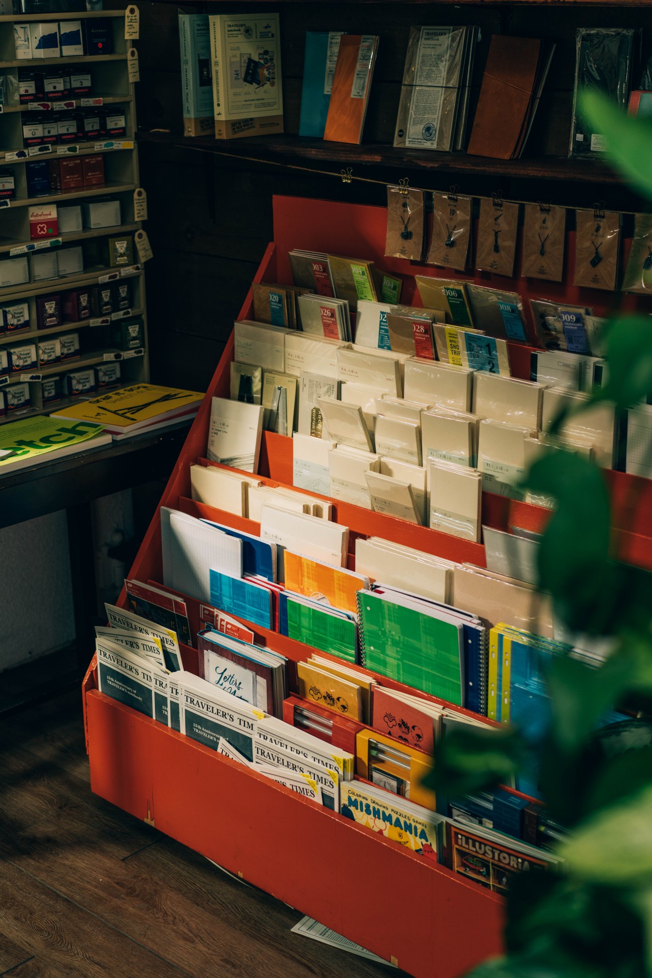 Display of various notebooks and journals from different brands arranged on shelving at Wonder Pens