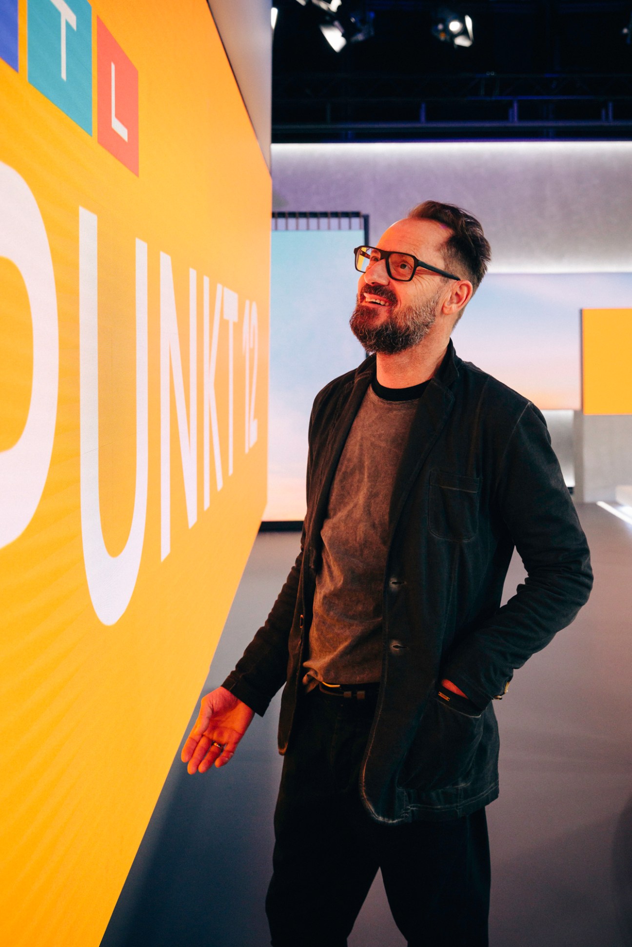 Josef Jumpers, project leader at RTL, standing in a modern television studio