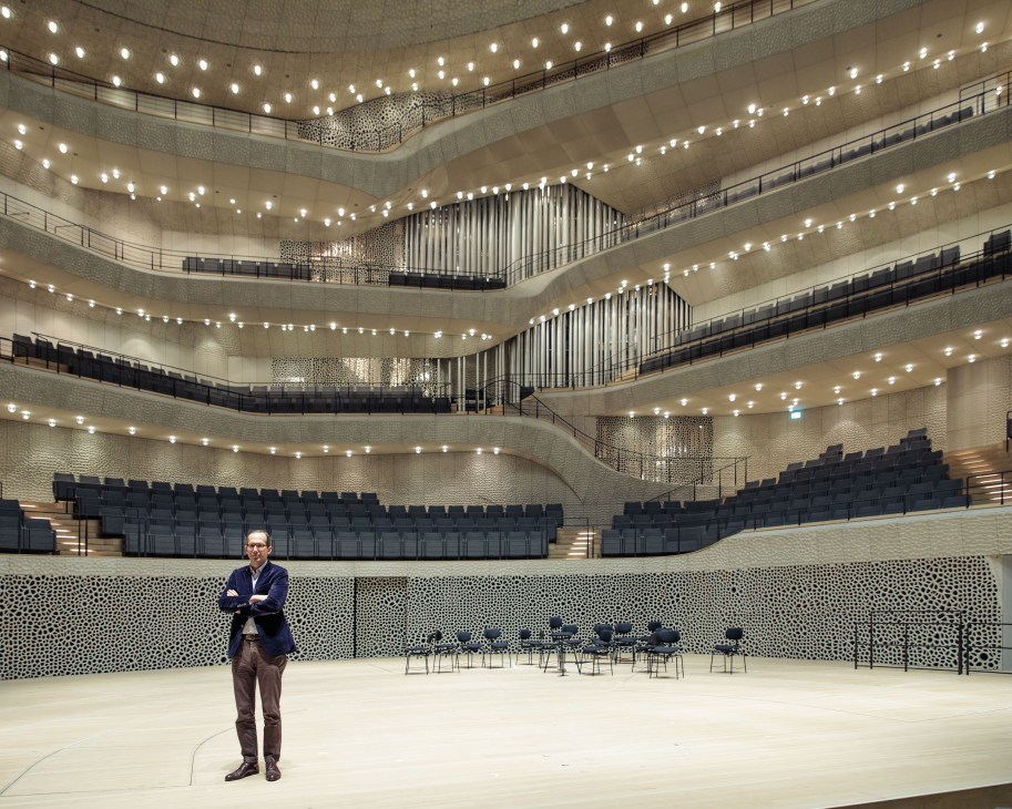 Christoph Lieben-Seutter stands in the Elbphilharmonie concert hall, designed by Herzog & de Meuron.