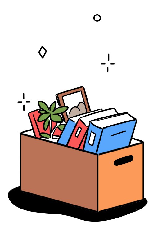 Cardboard box packed with office belongings including folders, books, picture frame and plant