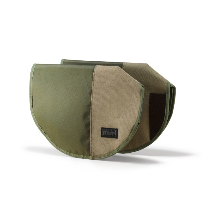 Green quilted cycle mitts with tan interior and Blue Lug branding label.