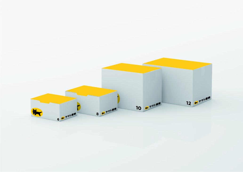Four white delivery boxes with yellow tops displaying Yamato's refreshed black cat logo in different sizes