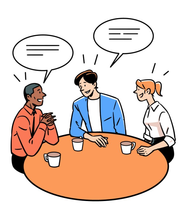 Three diverse professionals having an animated conversation around a round table with coffee cups