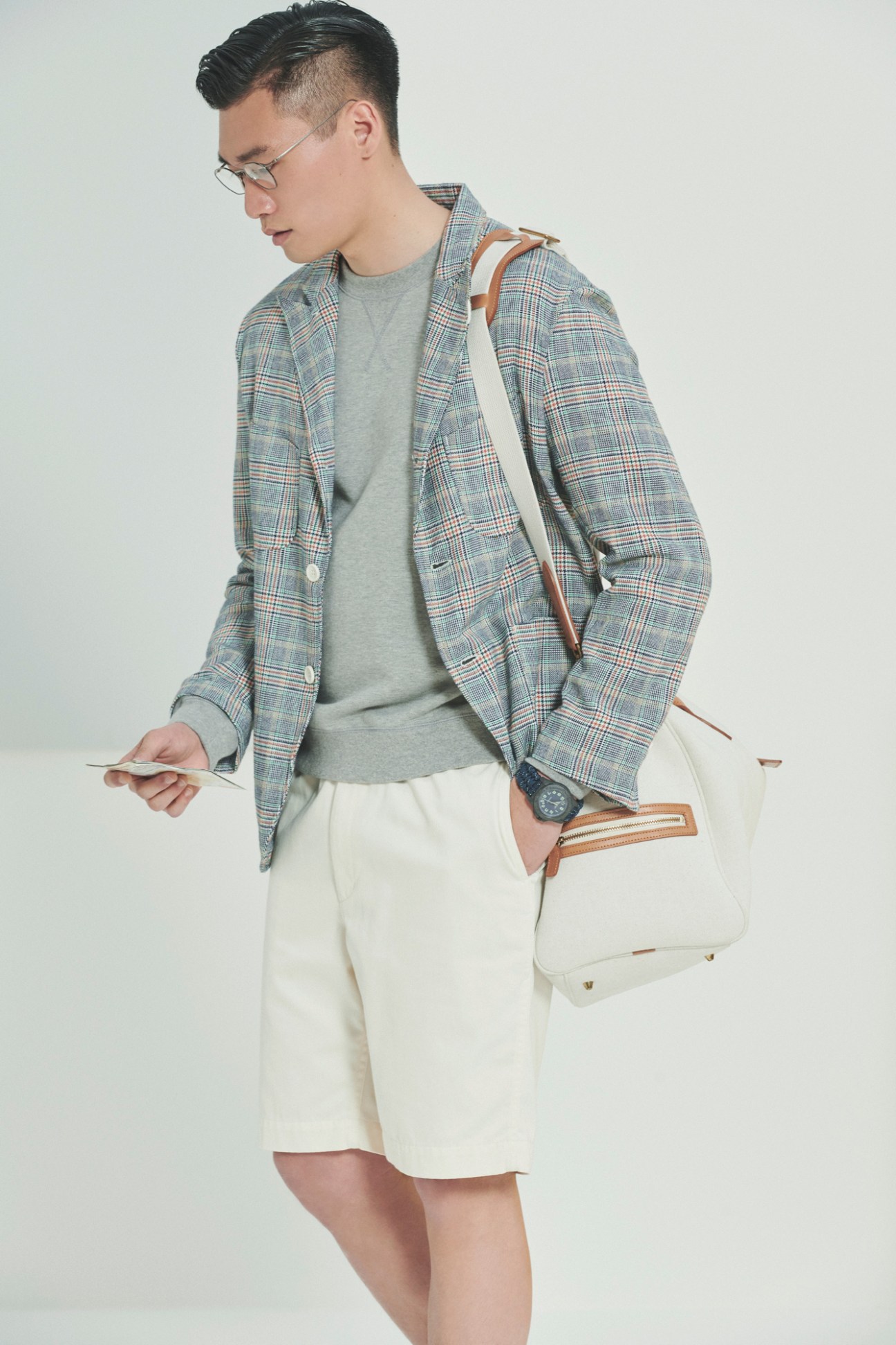 Model demonstrating comfortable travel style with functional pieces