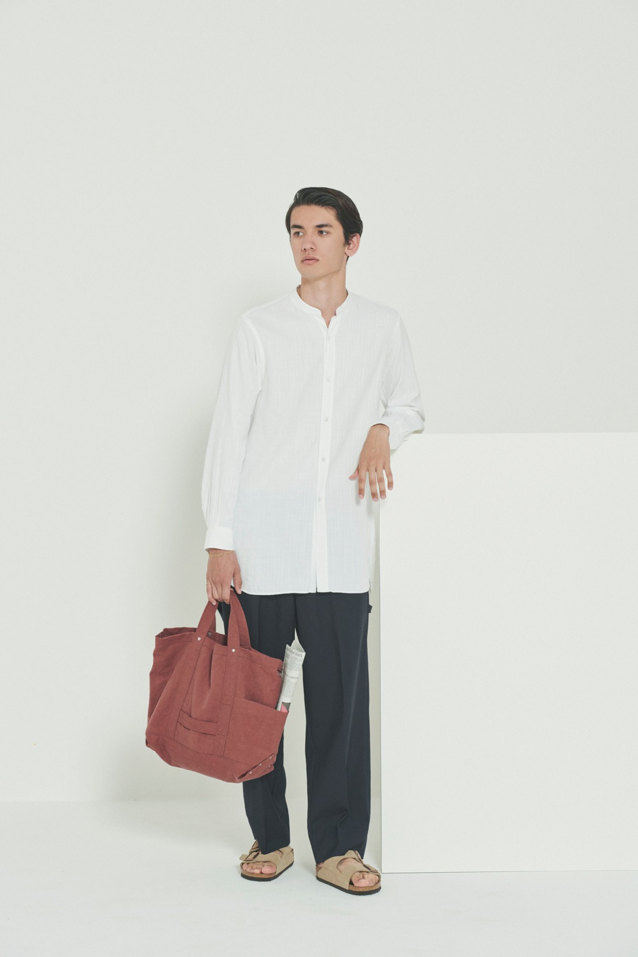 Model in practical yet fashionable travel attire
