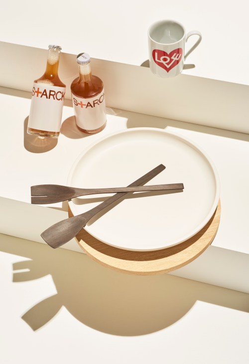 Modern architectural home objects displayed on minimalist white shelving