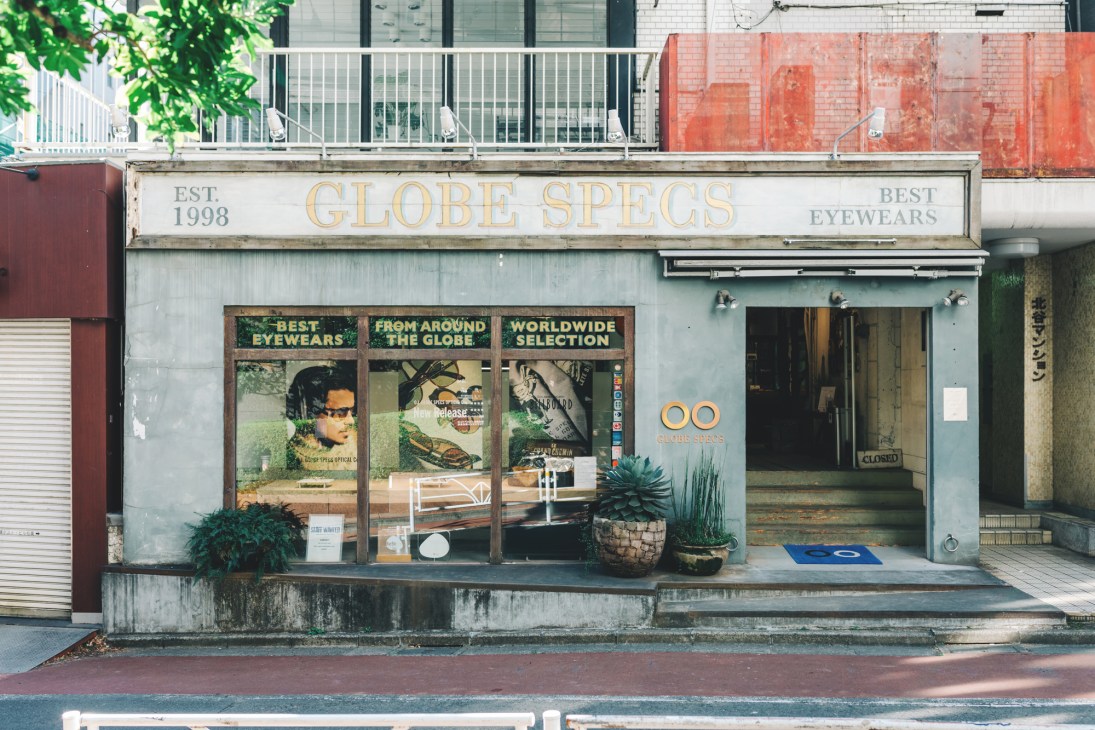 Interior view of Globe Specs eyewear shop in Shibuya with display cases of glasses and frames