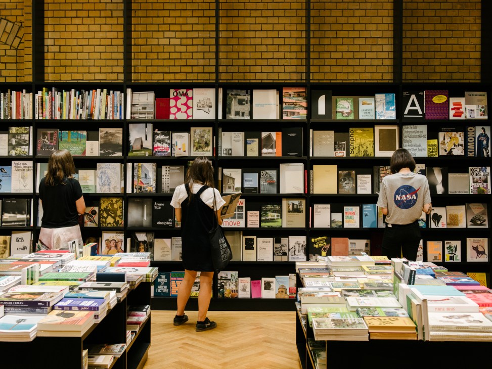 Interior view of bookshop with shelves of art books and publications in museum setting