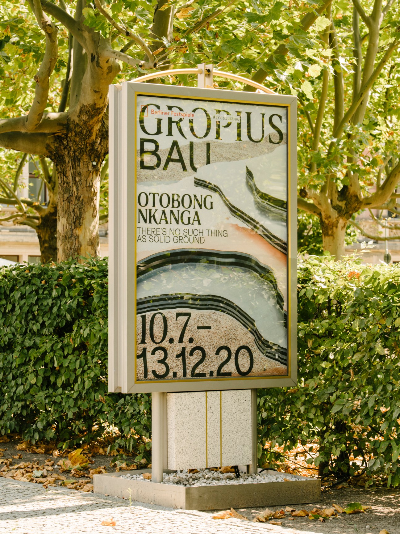 Colorful exhibition poster with flowing organic forms and text advertising Otobong Nkanga exhibition at Gropius Bau