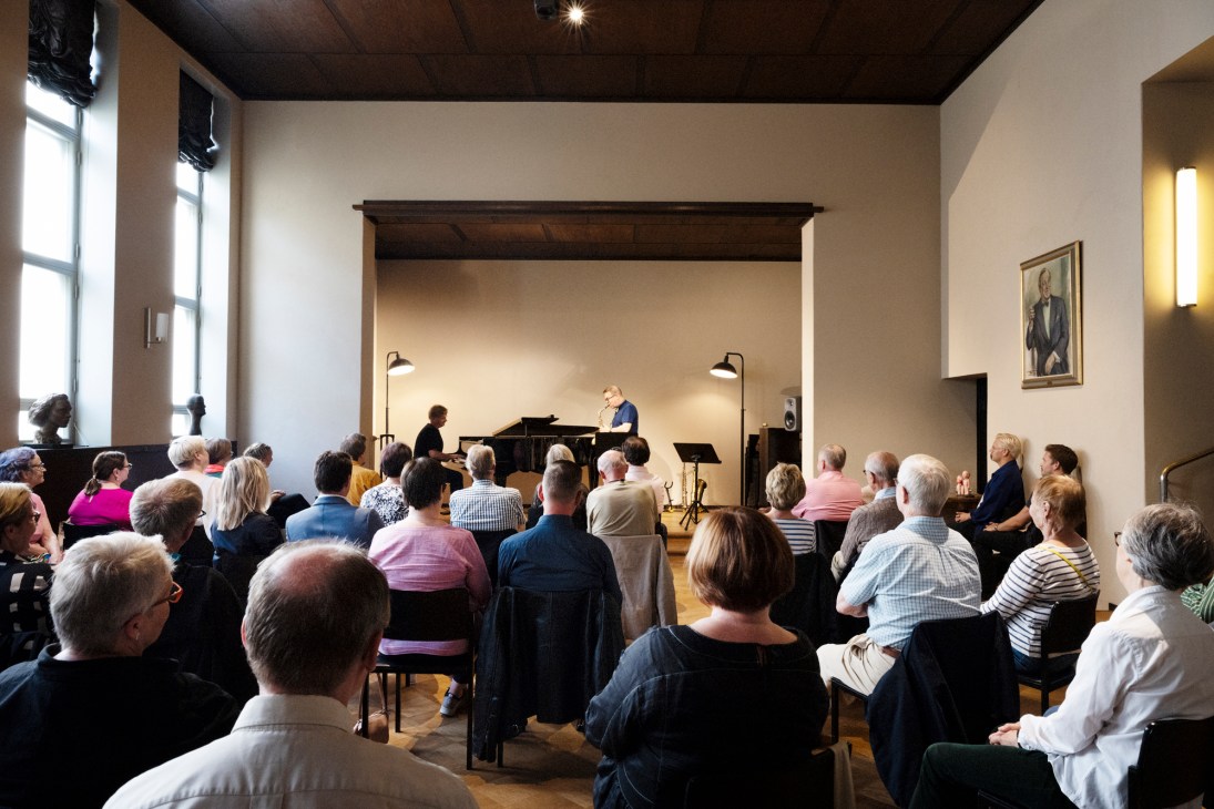 Finnish jazz musicians Iiro Rantala and Jukka Perko performing jazz music in the ballroom at Lallukka