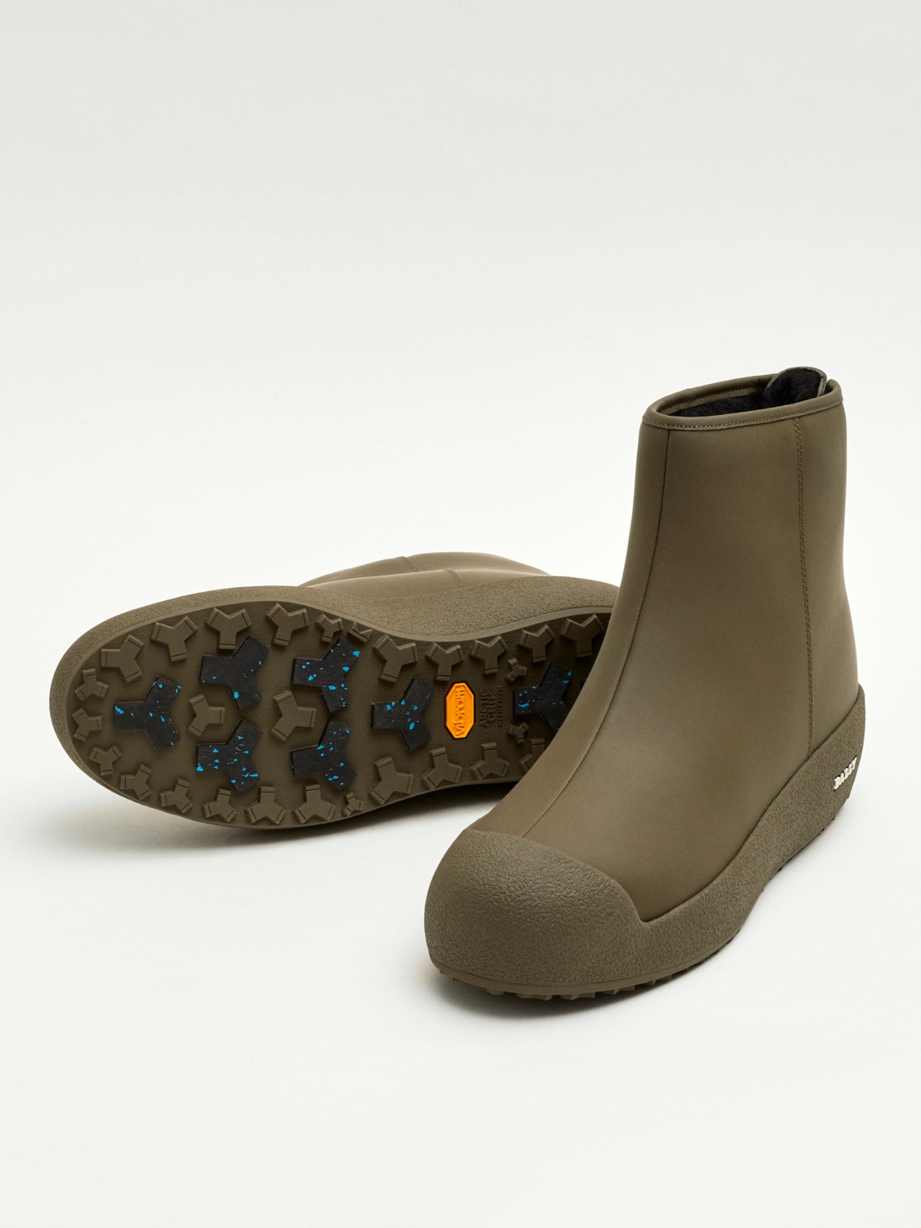 Olive green Bally x Monocle curling boot with Vibram sole against white background