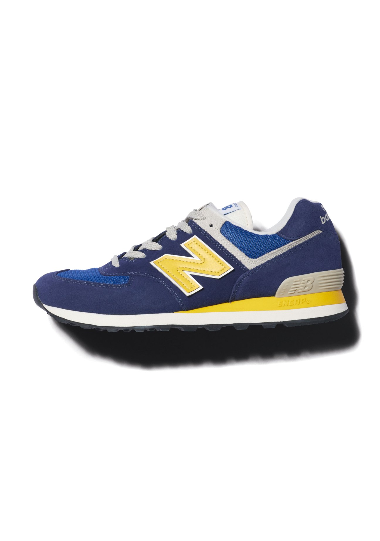 New Balance trainers in blue with yellow logo and accents