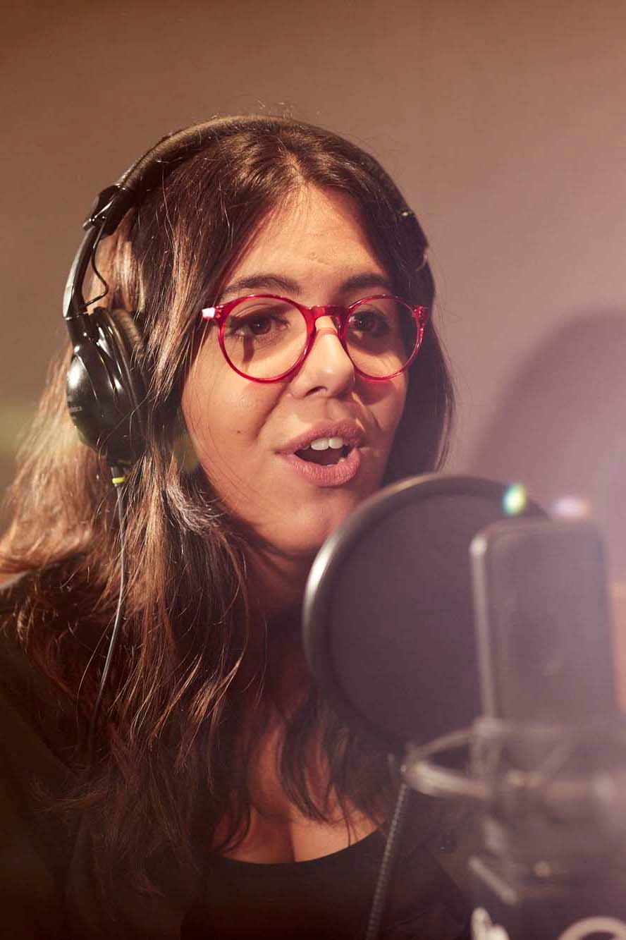 Producer and presenter Carlota Rebelo at work in the radio studio