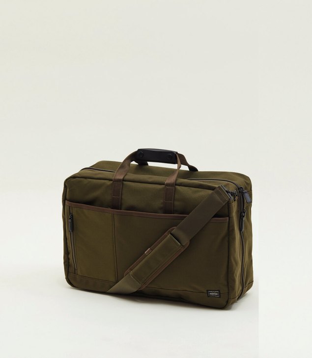 Olive green Porter x Monocle briefcase bag with shoulder strap and multiple compartments