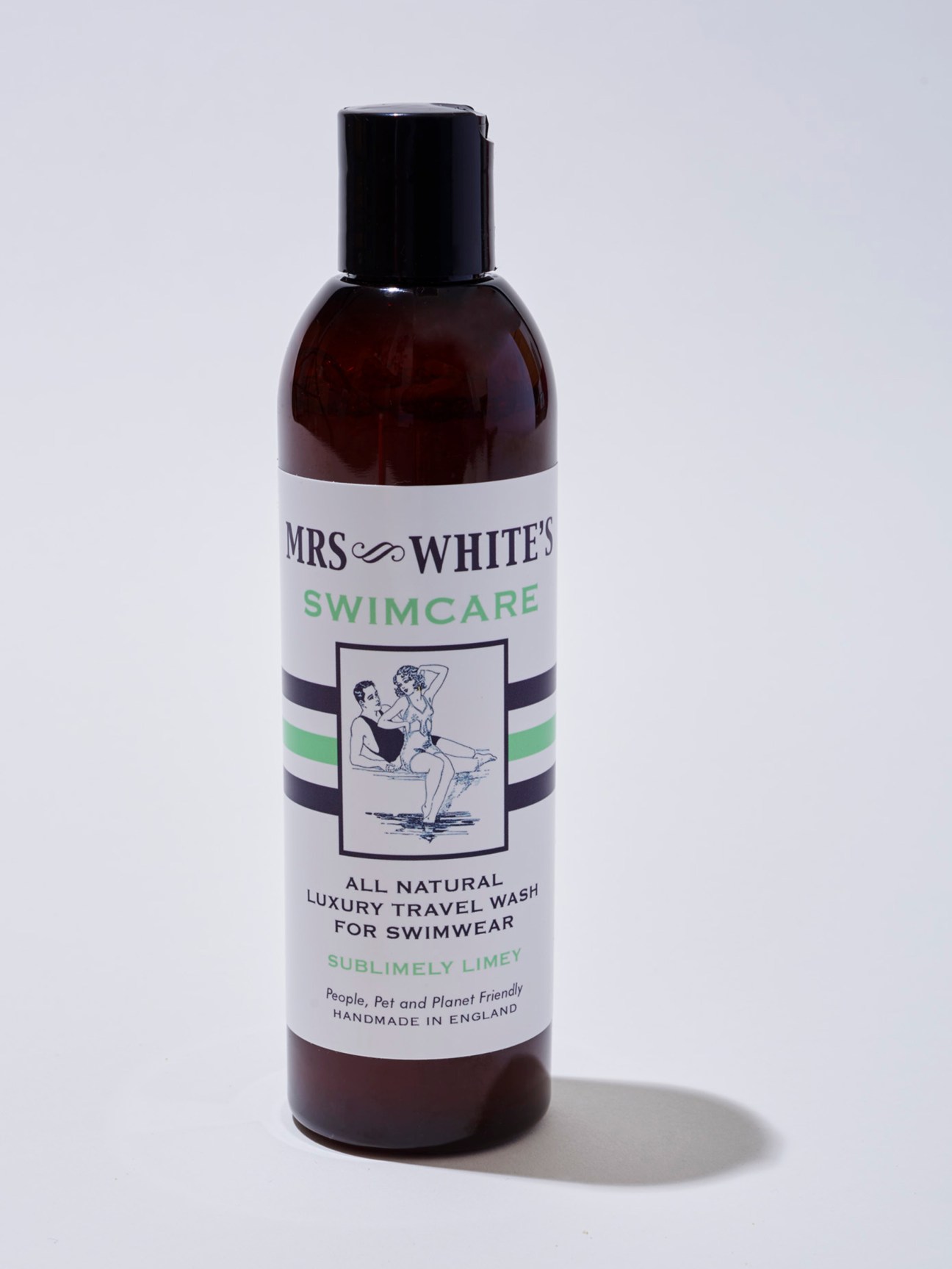 Mrs White's Swimcare luxury travel wash for swimwear in amber glass bottle with white label.