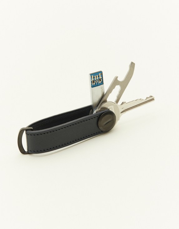 Orbitkey key organiser with USB and multitool in black leather with metal keys and tools.