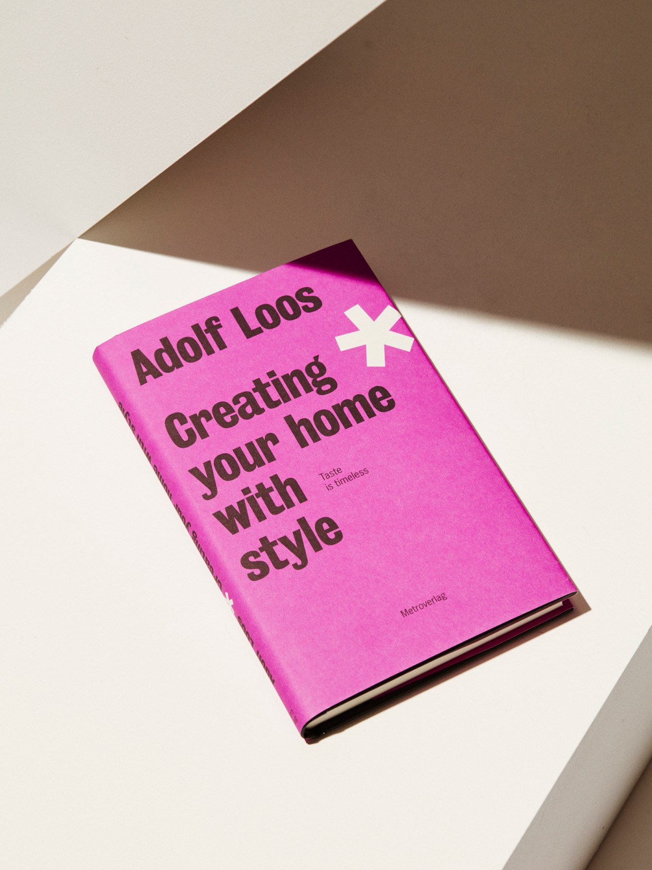 Pink book titled Creating Your Home with Style by Adolf Loos