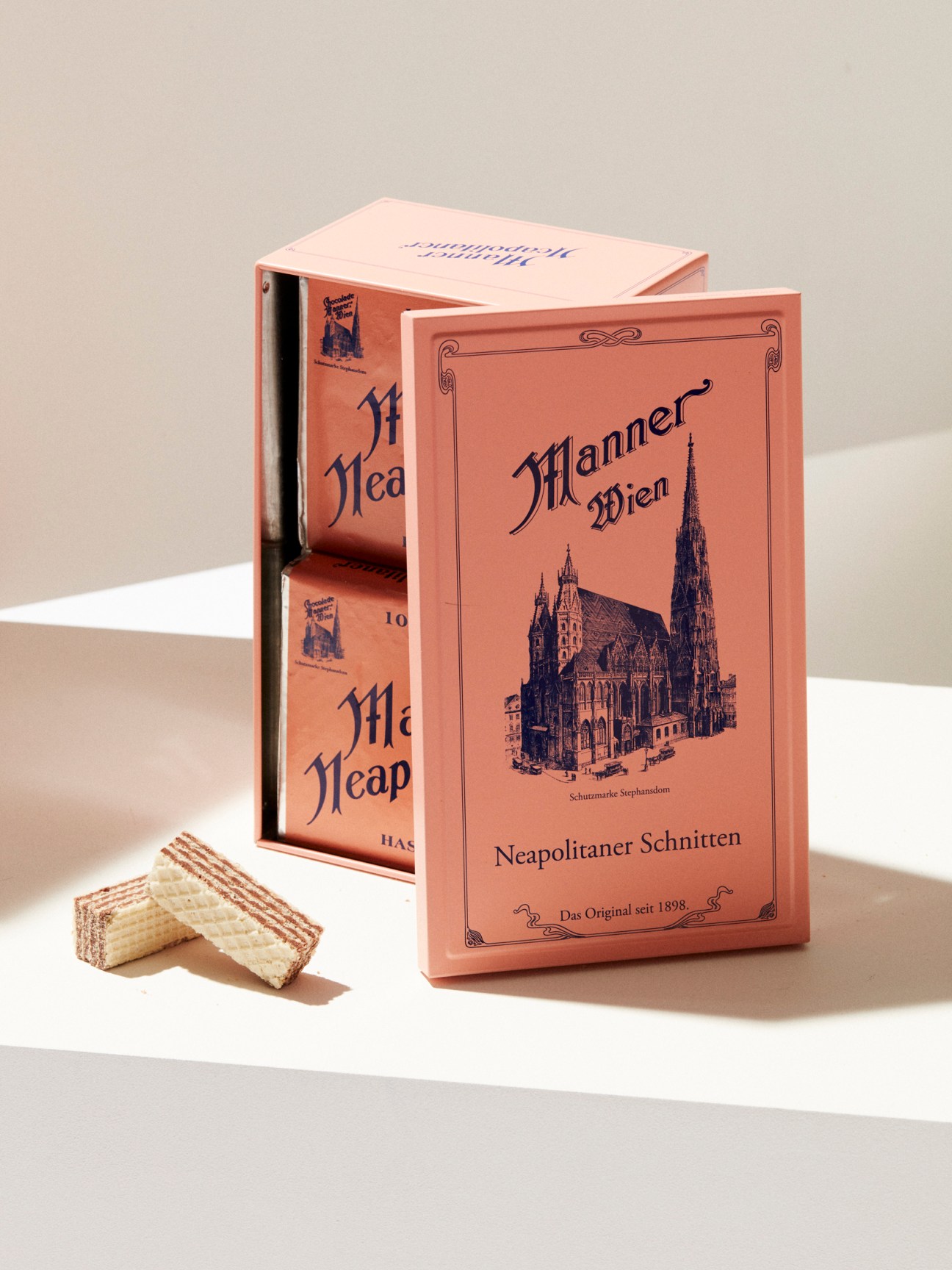 Manner wafer boxes featuring Vienna cathedral illustration with wafer cookies displayed