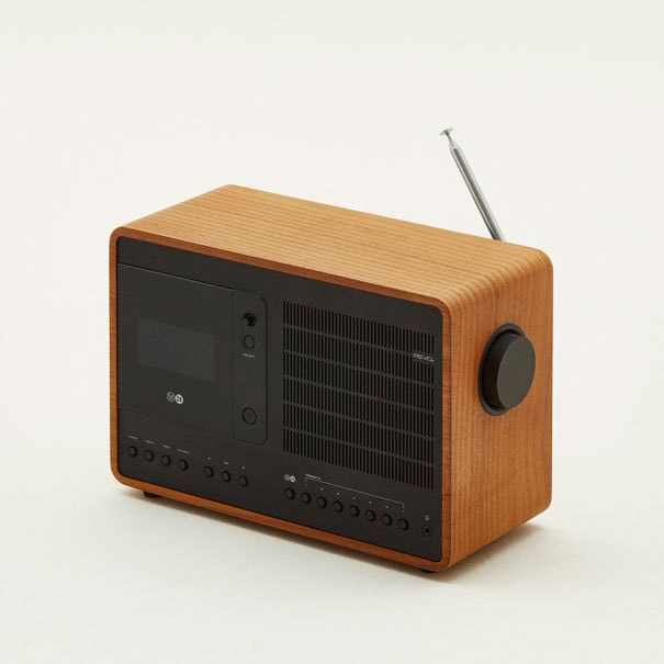Wood-finished digital radio with black control panel, small display screen, and extended antenna