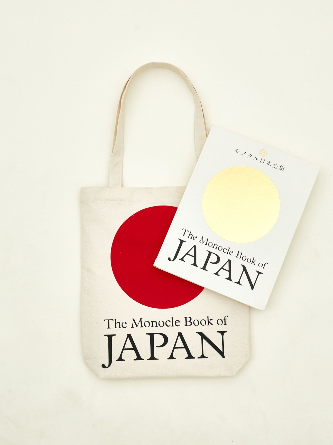 The Monocle Book of Japan displayed with a cream tote bag featuring red circle design