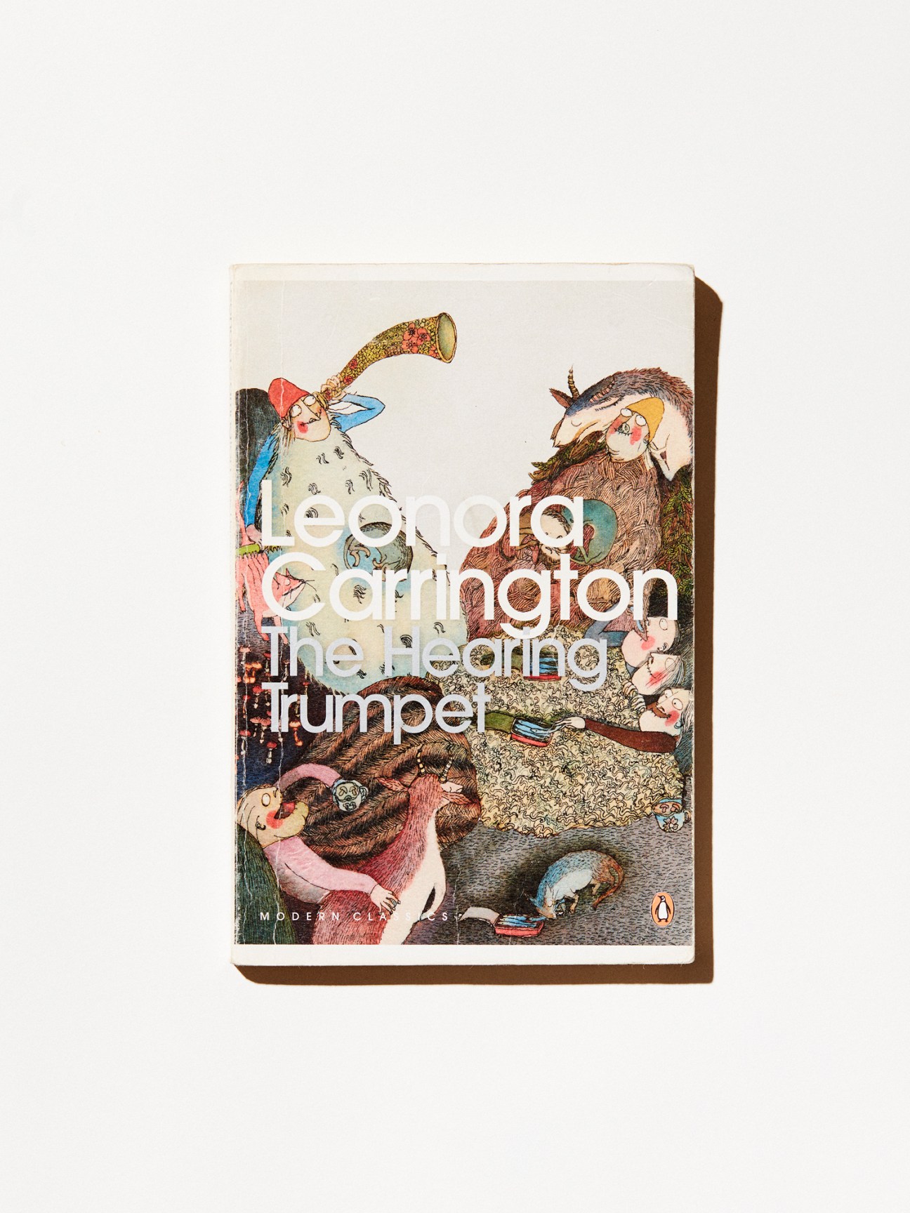 The Hearing Trumpet book cover by Leonora Carrington featuring surreal illustrated characters