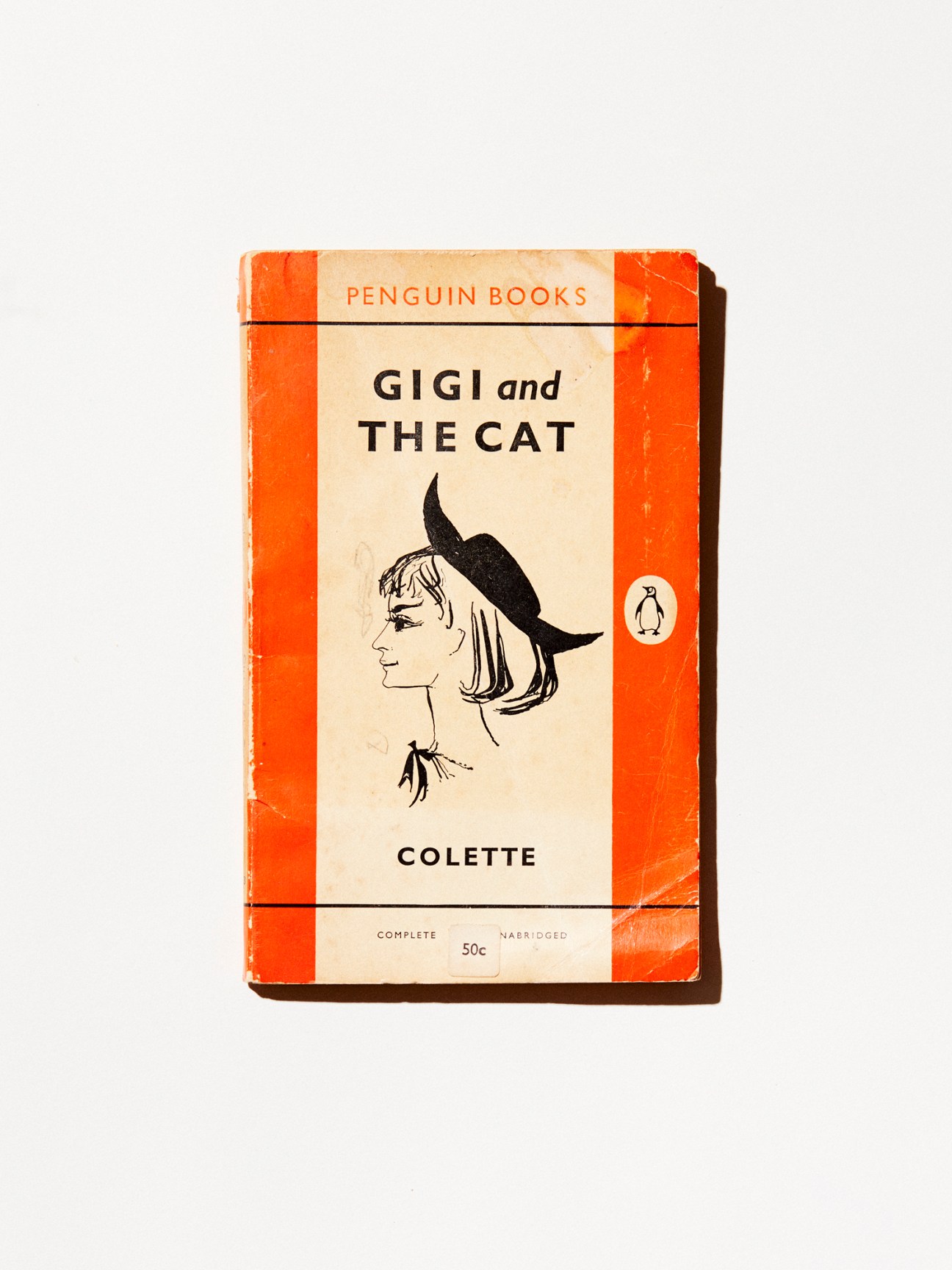 Vintage Penguin Books paperback cover of Gigi and the Cat by Colette with illustrated woman's profile