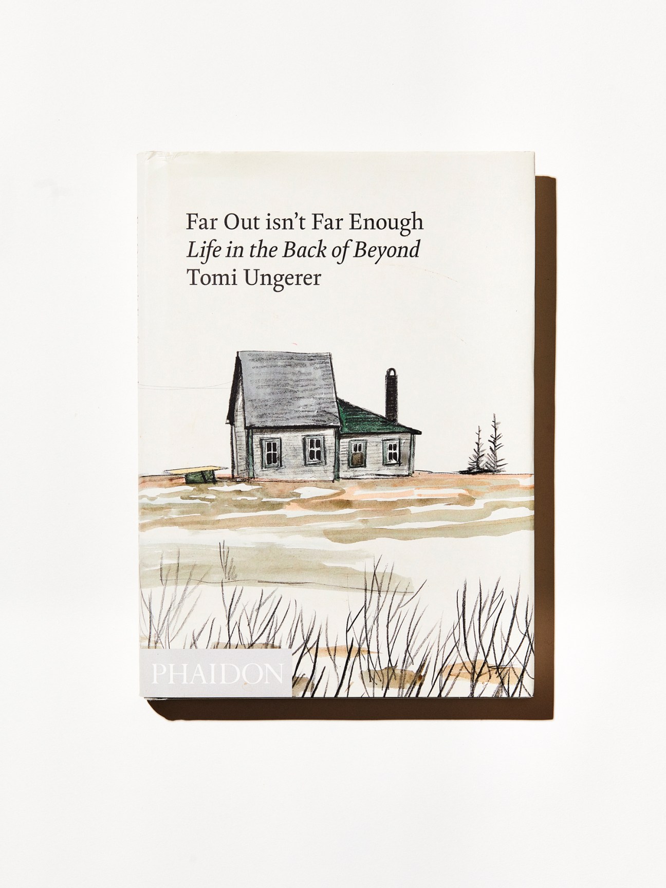 Far Out Isn't Far Enough book cover by Tomi Ungerer showing a watercolor house by a lake