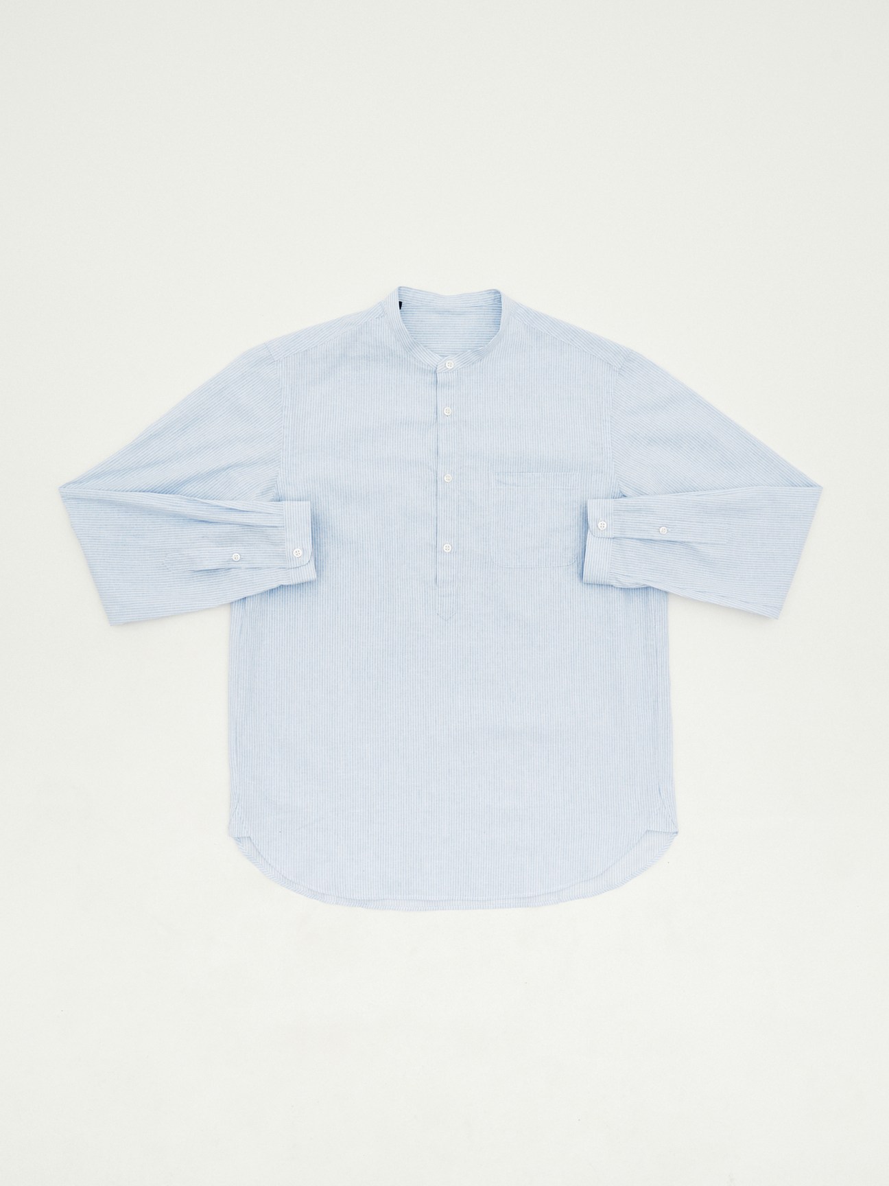 Light blue pinstripe cotton-linen shirt with mandarin collar and long sleeves laid flat
