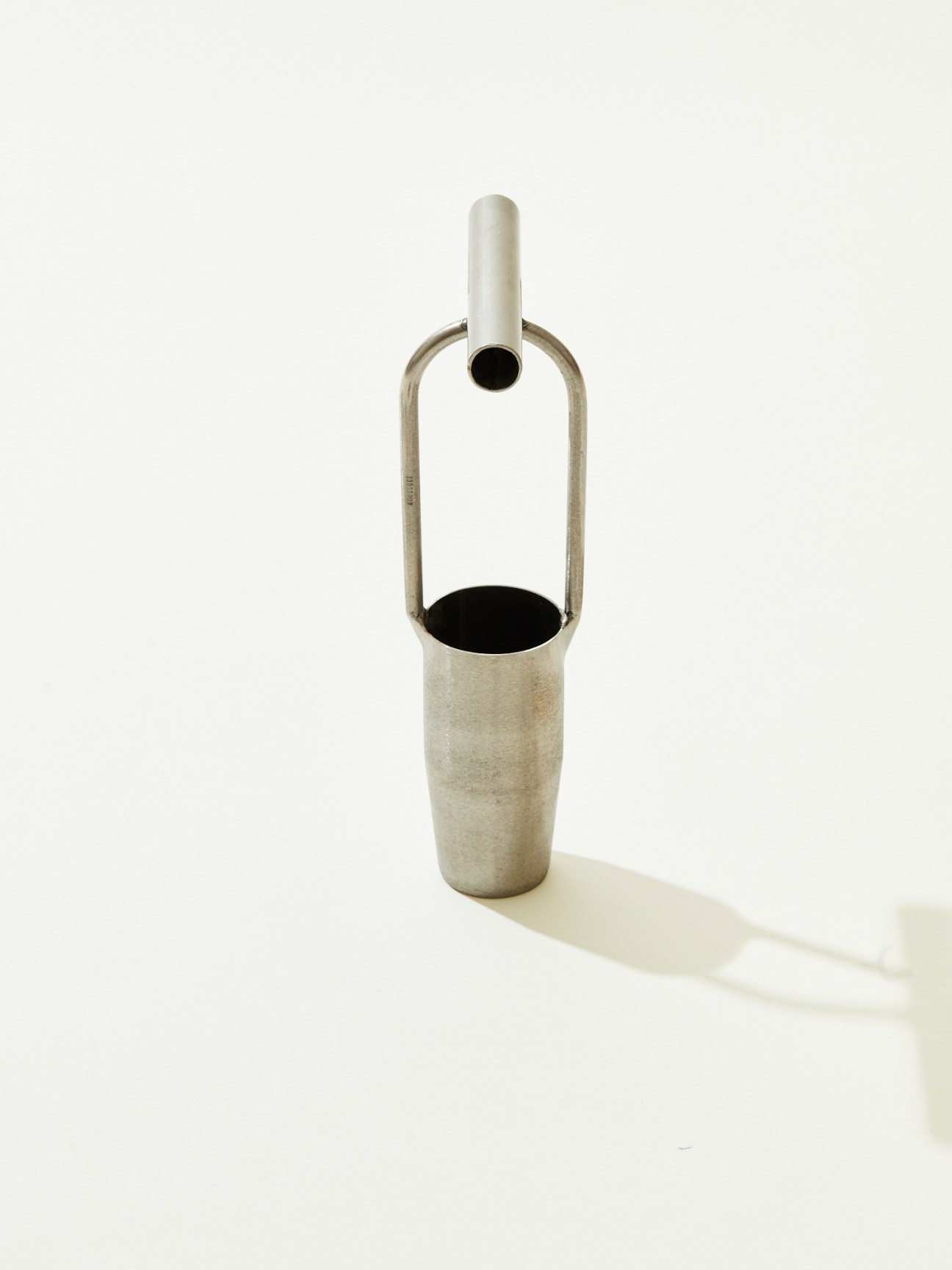 Hand-forged stainless steel bulb planter by Sneeboer with cylindrical design and handle