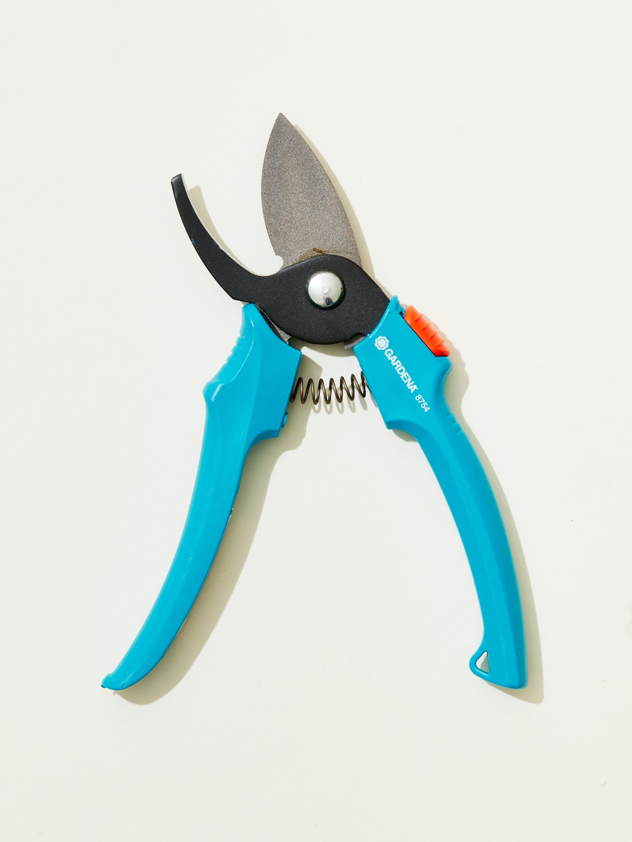 Blue ergonomic secateurs with black cutting blade and spring mechanism by Gardena