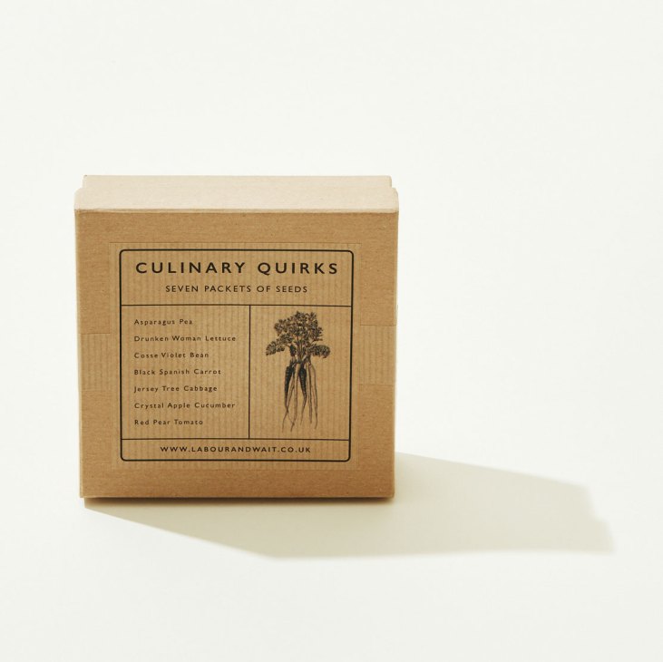 Wooden box labeled Culinary Quirks containing seven packets of vegetable seeds