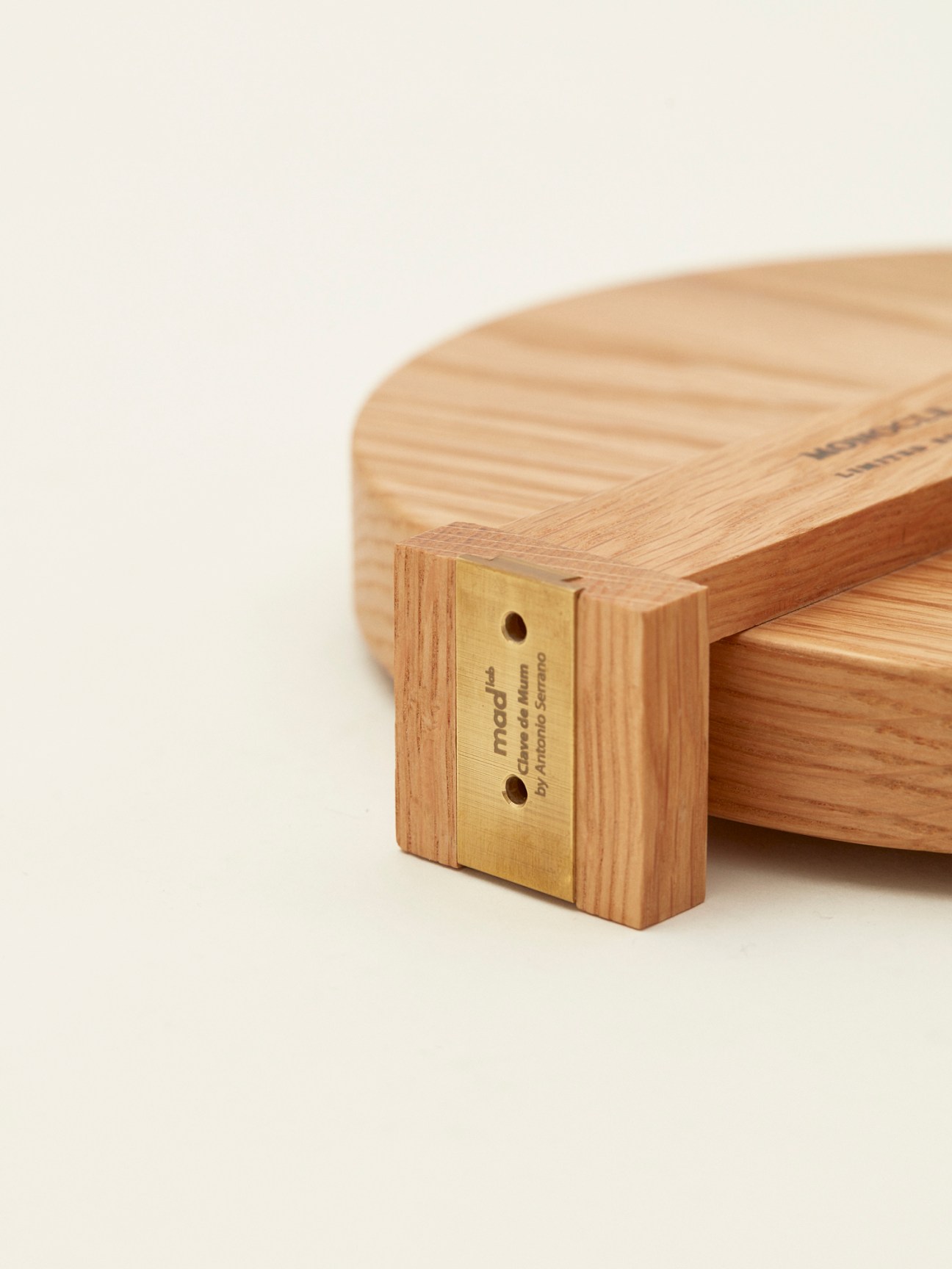 Monocle x Mad Lab oak key tray detail showing brass corner elements and wood grain