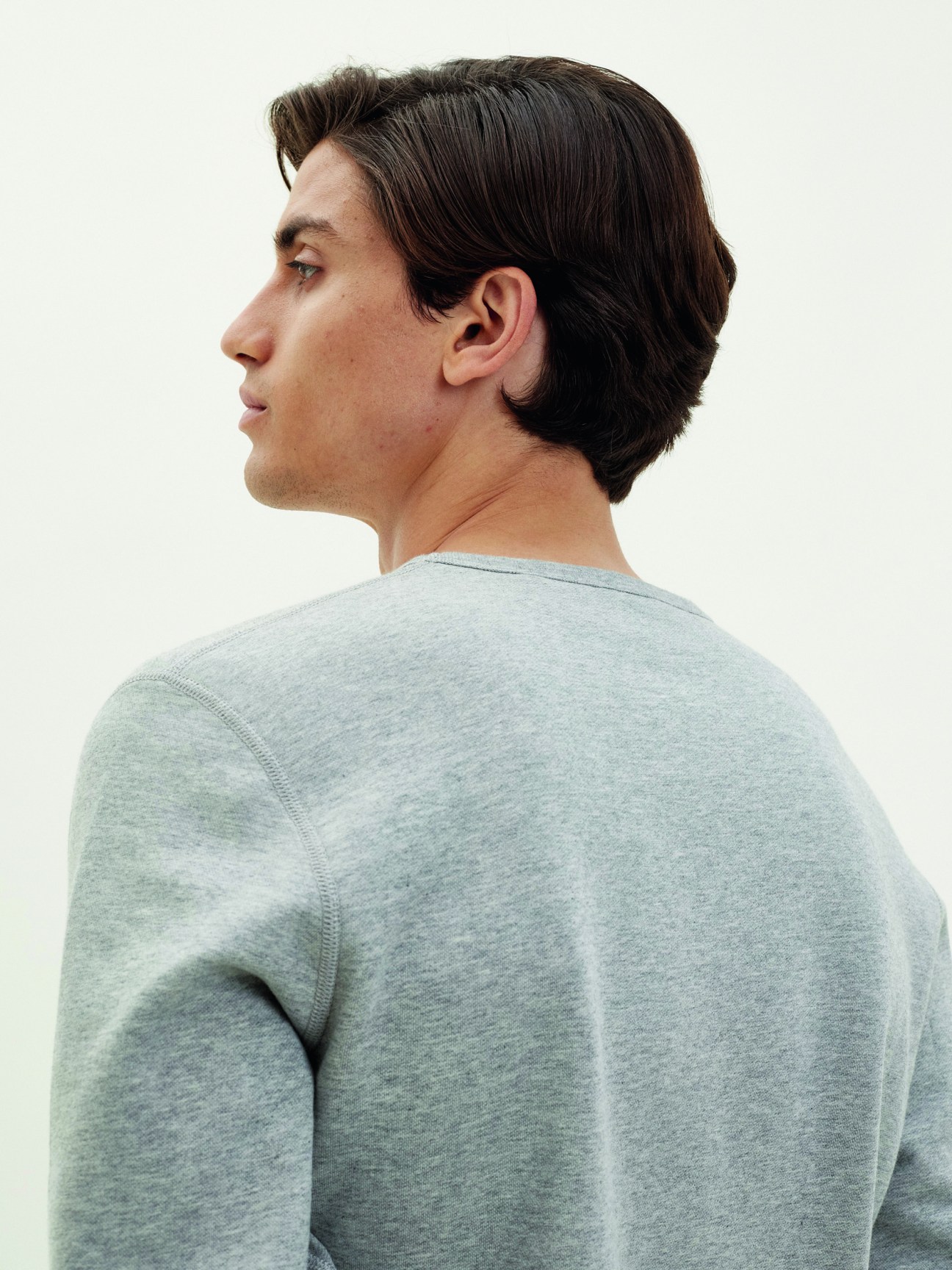 Grey melange cotton sweatshirt with round neckline displayed on model