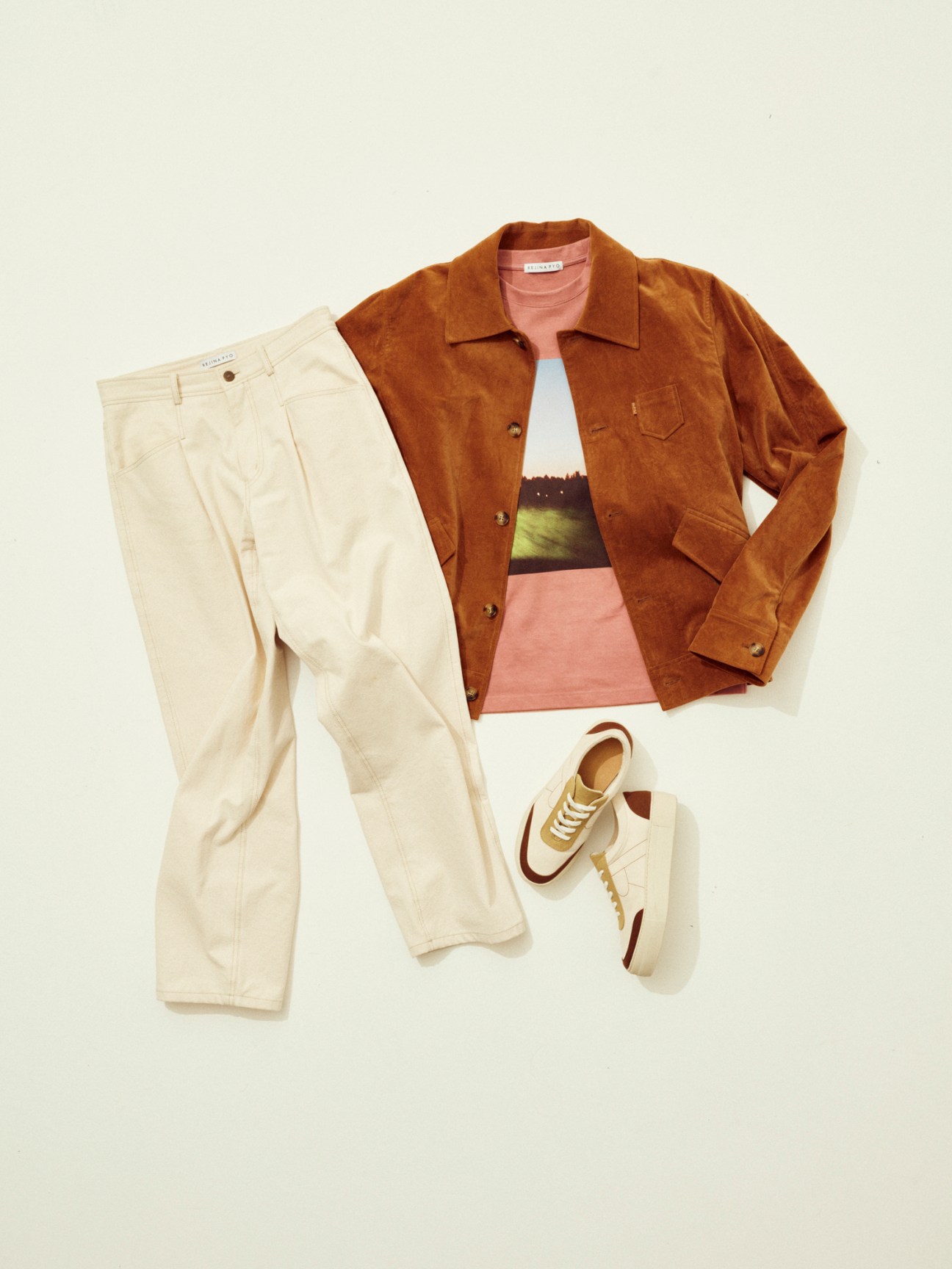 Rejina Pyo unisex clothing flat lay featuring brown corduroy jacket, pink top, cream pants and sneakers