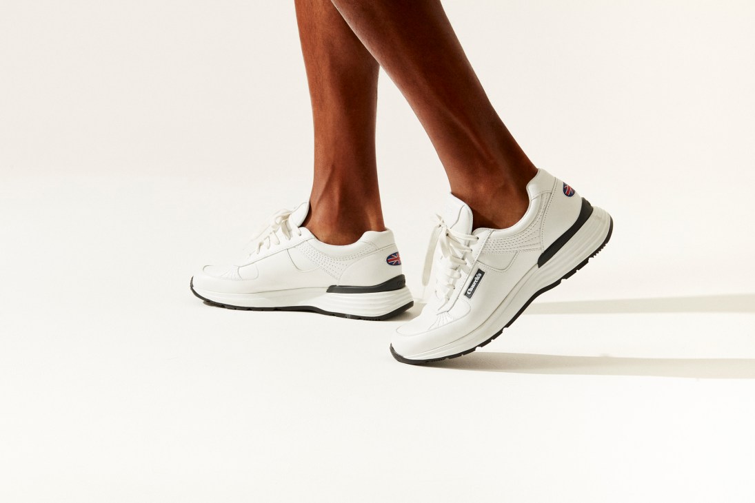 CH873 sneaker by Church's in white leather with person's legs in walking motion
