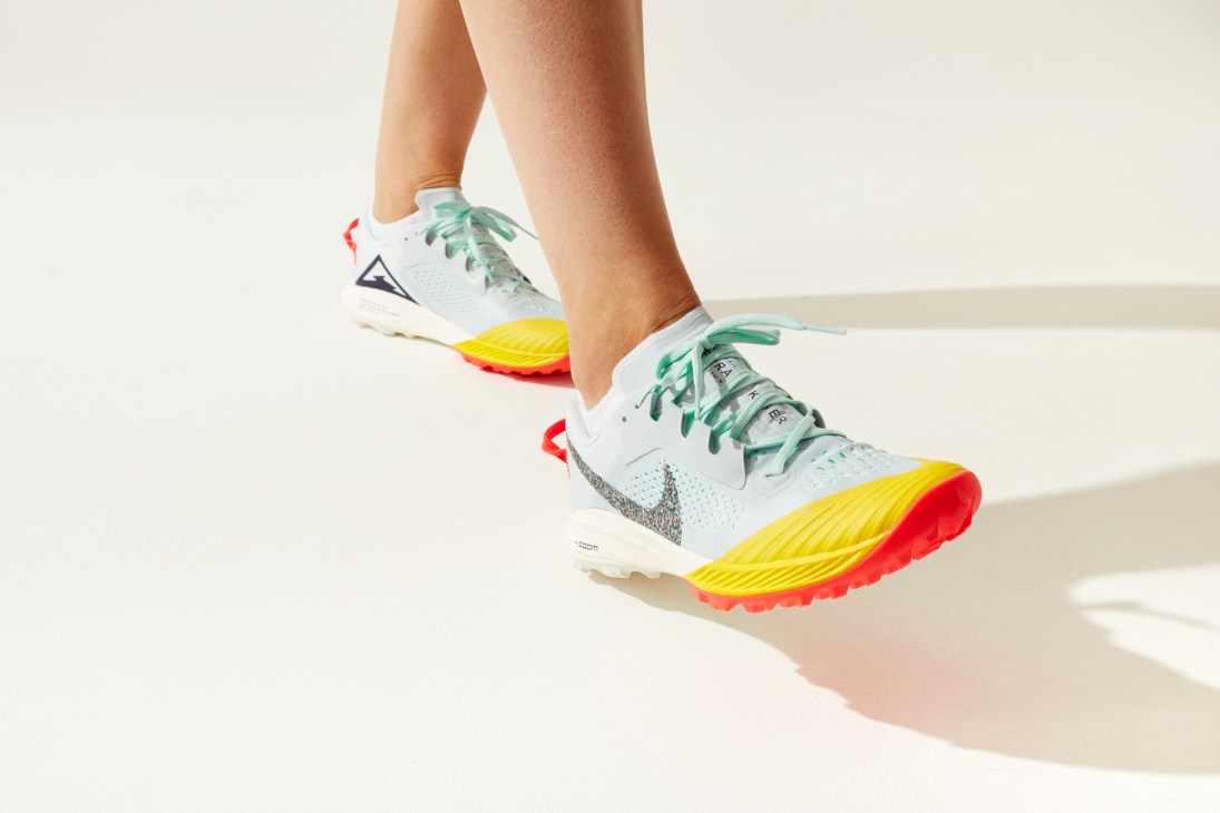 Nike Air Zoom Terra Kiger 6 trail running shoe by Nike with colorful rainbow sole and green laces