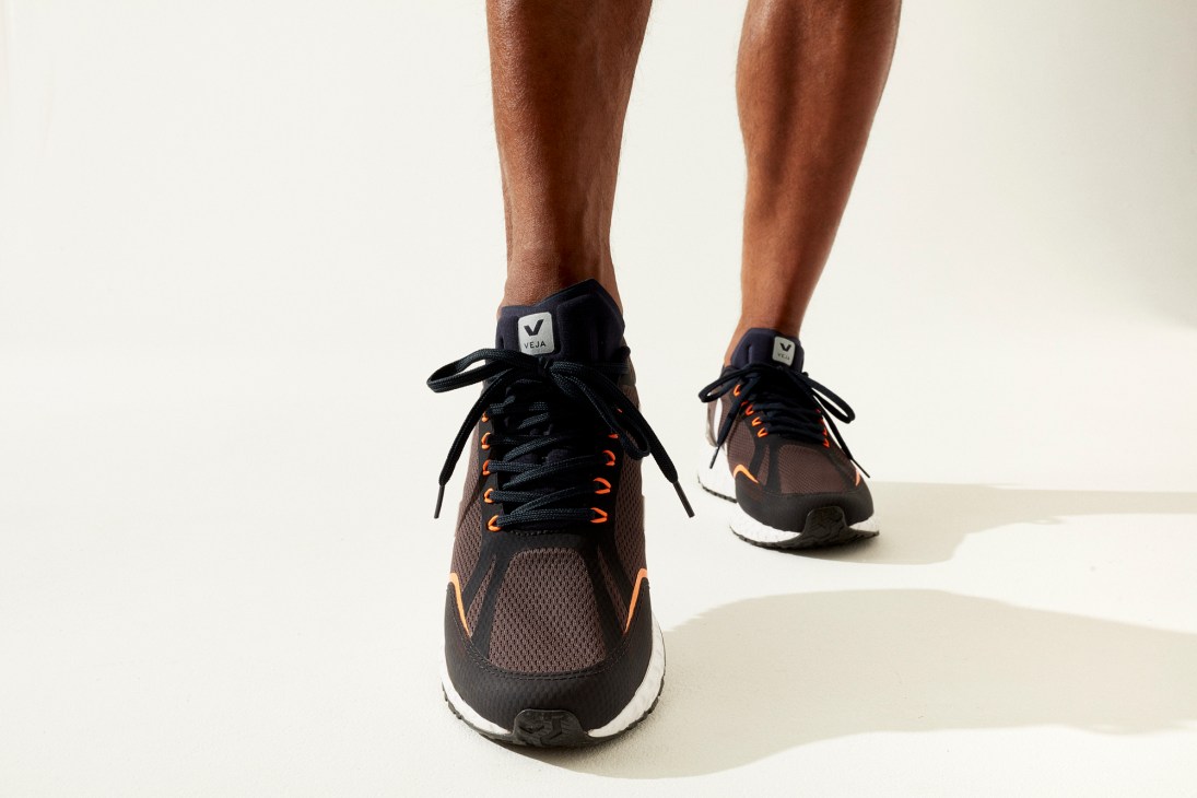 Condor ecological running trainer by Veja in dark colorway with orange accents and mesh upper