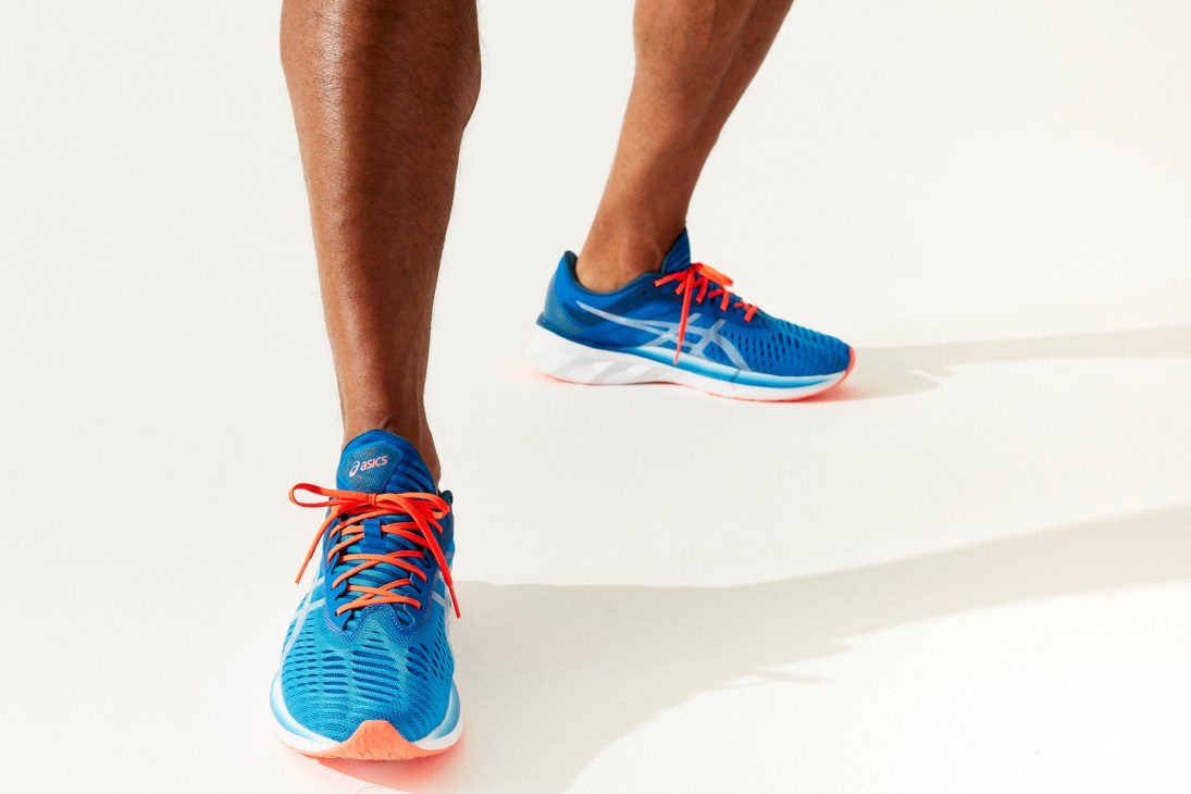 Novablast running shoe by Asics with distinctive blue and orange colorway in motion