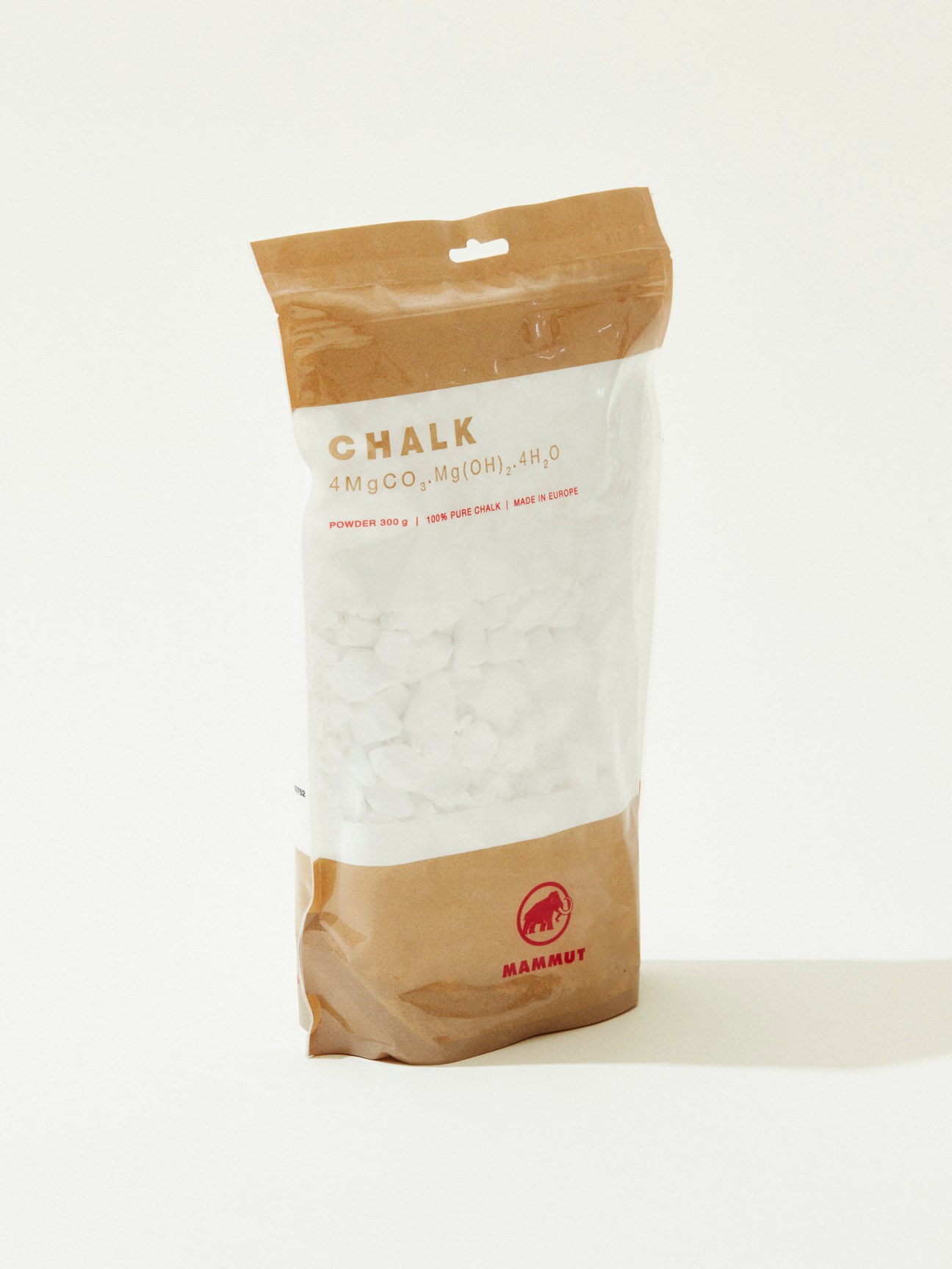 White and brown Mammut climbing chalk powder bag with chemical formula on white background